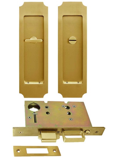 Premium Pocket-Door Mortise Lock Set with Chamfered Corner Pulls in Aged Brass.